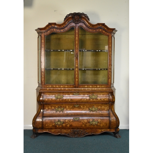 199 - A Dutch walnut, fruitwood and marquetry bombe display cabinet, 19th century The arched top centred b... 