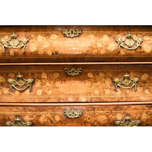 199 - A Dutch walnut, fruitwood and marquetry bombe display cabinet, 19th century The arched top centred b... 