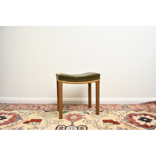 200 - A 1953 Queen Elizabeth II coronation, limed oak stool, the concave shaped seat covered in a blue vel... 