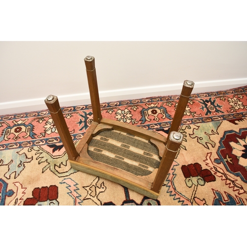 200 - A 1953 Queen Elizabeth II coronation, limed oak stool, the concave shaped seat covered in a blue vel... 