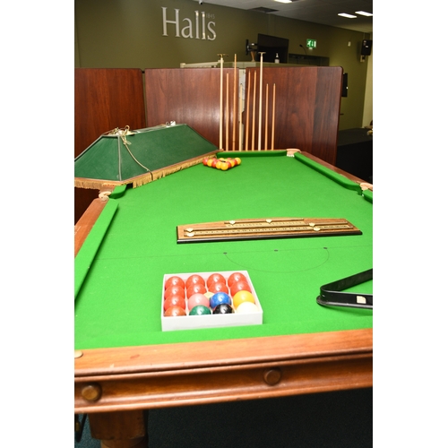 201 - A standard 8ft billiards table, late 20th century By A & D Billiards, in mahogany with slate bed and... 