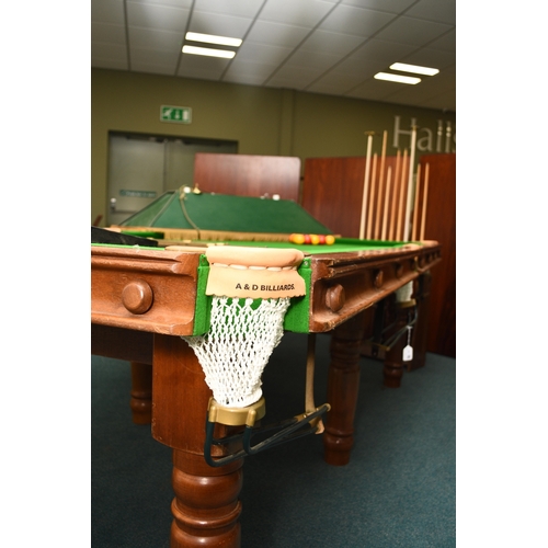 201 - A standard 8ft billiards table, late 20th century By A & D Billiards, in mahogany with slate bed and... 