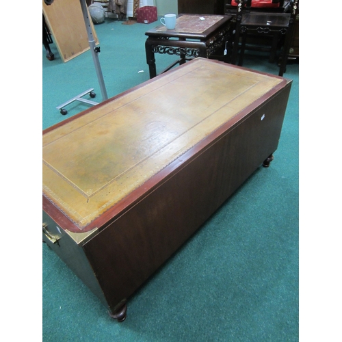 204 - A reproduction campaign type coffee table chest The brass-mounted top inset with a tooled green leat... 