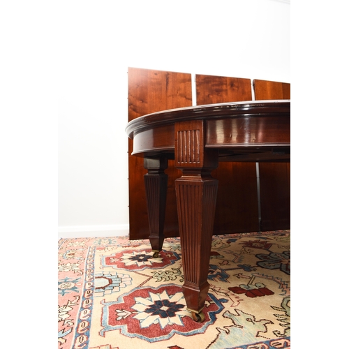 208 - A reproduction mahogany wind-out extending dining table, circa 1920s The moulded D-end top above a b... 