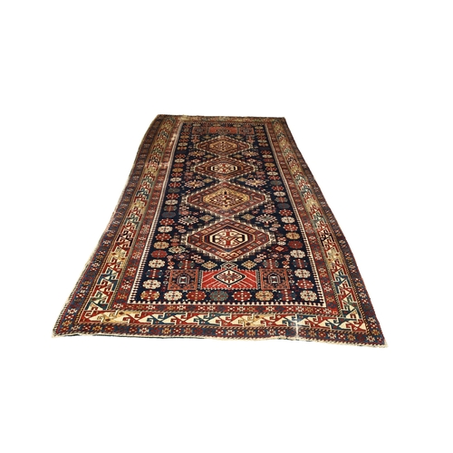 217 - A Qashqai kelim rug, first half 20th century 277cm x 137cm Condition:Wear to all four edges. Wear to... 