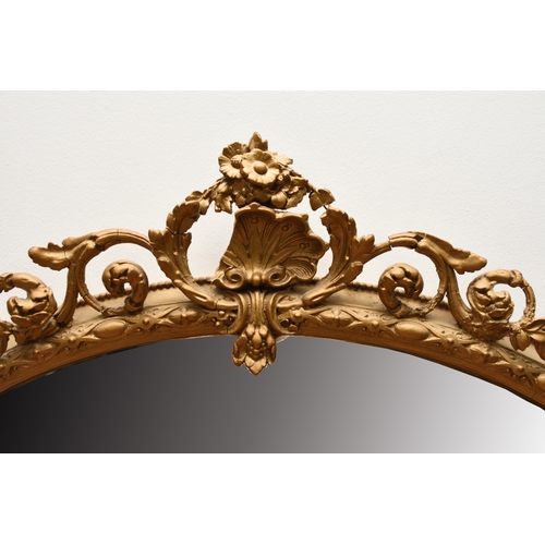 213 - A Victorian giltwood overmantel mirror The oval plate within a moulded frame with shell cresting. 13... 