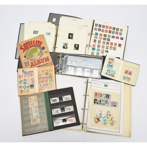 184 - Large accumulation of stamps in albums in purple crate and a 