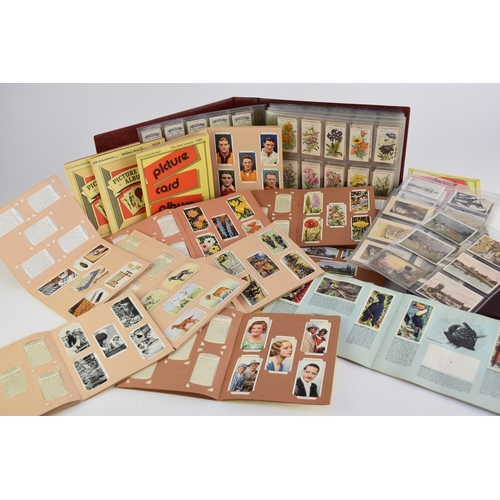 187 - A collection of cigarette cards including Wills and Players sets in album 