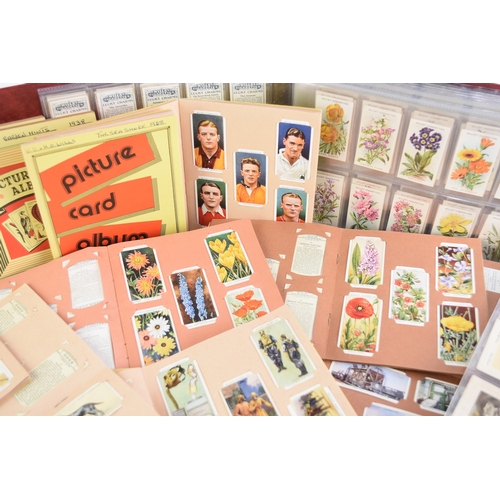 187 - A collection of cigarette cards including Wills and Players sets in album 