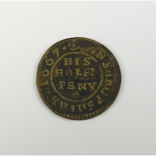 194 - A Shropshire 17th century copper token of Madeley, half penny - John Holland, 1667, Pickaxe