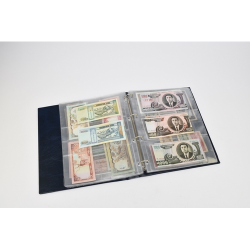 237 - An album containing 113 all world banknotes to include UK ten shillings to twenty pounds, including ... 