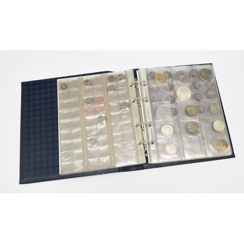 242 - An album containing a collection of approximately 63 USA silver cupro-nickel and bronze coinage from... 