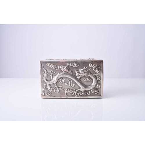 103 - A Chinese silver box, Wang Hing Of rectangular outline with hinged cover, embossed and chased with d... 