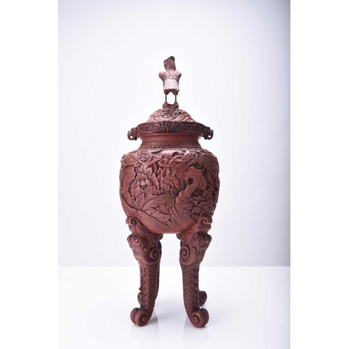 105 - A Chinese cinnabar lacquer censer and cover, Qing Dynasty Of ovoid form raised on four dragon scroll... 