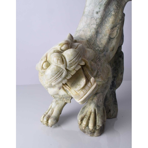 129 - A Chinese carved quartzite figure of a stalking tiger, 20th century Of mottled green hue, stylistica... 