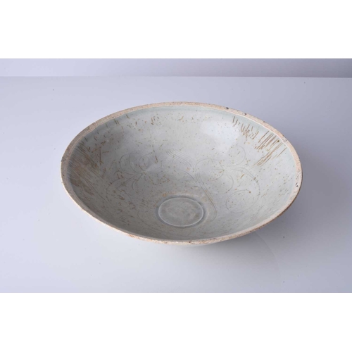 13 - A Chinese qingbai bowl, Song Dynasty Of conical form, the interior with combed decoration of stylise... 