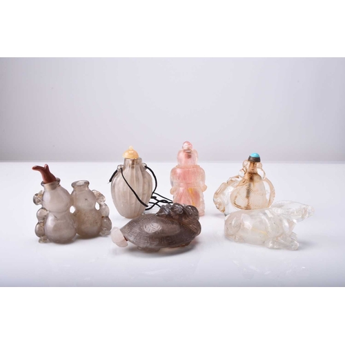 145 - A group of six Chinese carved crystal snuff bottles, 19th/20th century The first modelled as a lion,... 