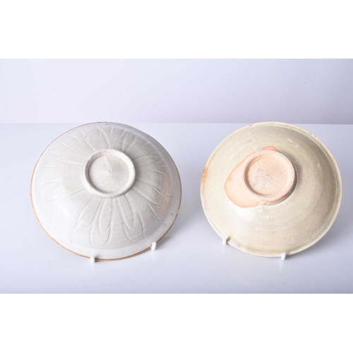 15 - Two Chinese Qingbai bowls, Song/Yuan Dynasty The first of shallow rounded form, the inside carved wi... 