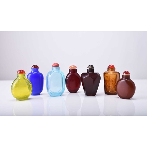 156 - A group of seven Chinese glass snuff bottles, 19th/20th century Varying in colour and form. Largest ... 