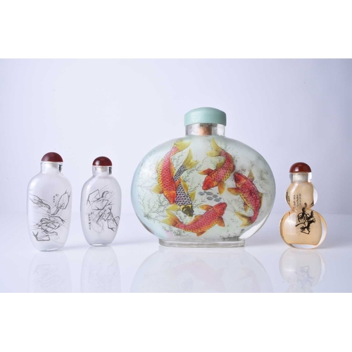 174 - A group of four Chinese internally painted snuff bottles, 20th century Including one large ovoid bot... 