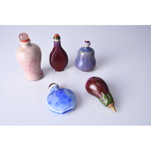 177 - A group of five Chinese porcelain snuff bottles, 19th century Of varying form, each decorated with a... 