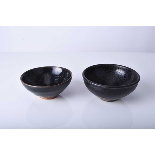 18 - Two Chinese Jian ware bowls, Song Dynasty Of conical form, each decorated with a rich near-black gla... 