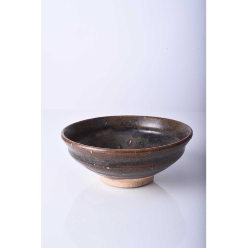 19 - A Chinese Jian ware bowl, possibly Song Dynasty Of conical form and covered in a thick near black gl... 