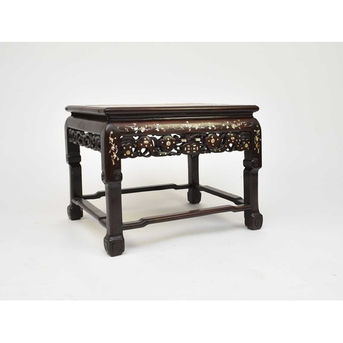 208 - A Chinese inlaid rosewood table or seat, Qing Dynasty, 19th century The moulded top inset with pink-... 