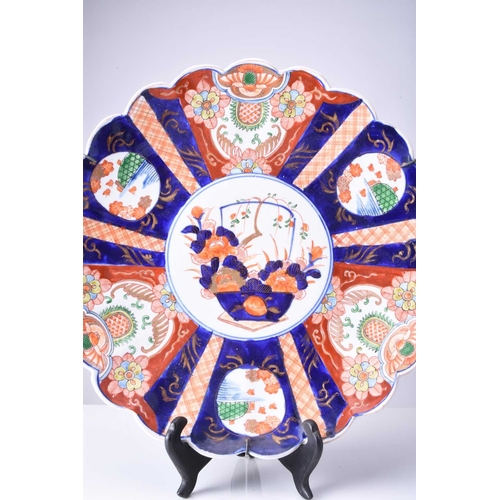 212 - Japanese Imari dish, Meiji era Of lobed circular form and decorated with panels of flowers, foliage ... 