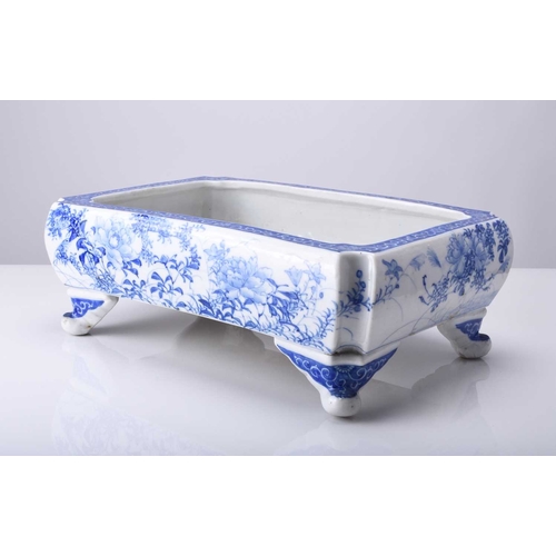 214 - A Japanese Seto blue and white porcelain jardiniere, Meiji era Of rectangular form with lobed corner... 