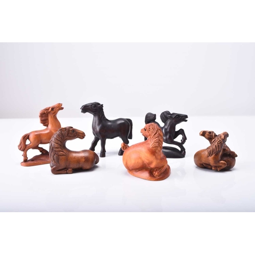 226 - A group of six Japanese wood netsuke of horses, 20th century Each naturalistically modelled and inse... 