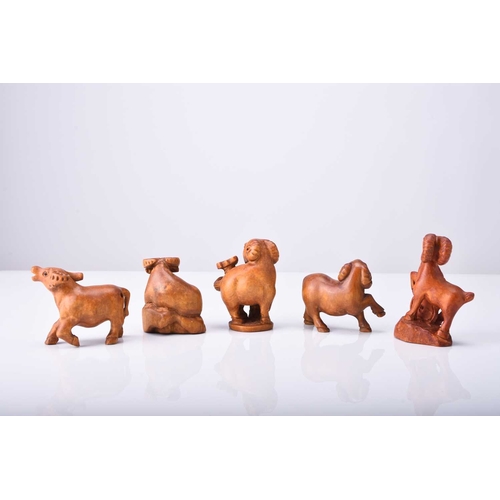 229 - A group of five Japanese wood netsuke modelled as animals, 20th century Including three rams and two... 