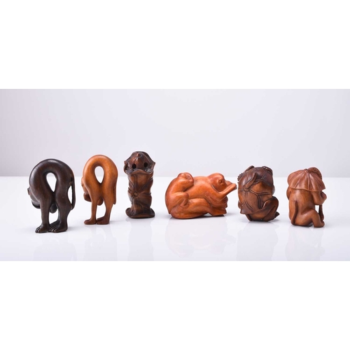 238 - A group of six Japanese wood netsuke of apes and monkeys, 20th century Naturalistically and stylisti... 