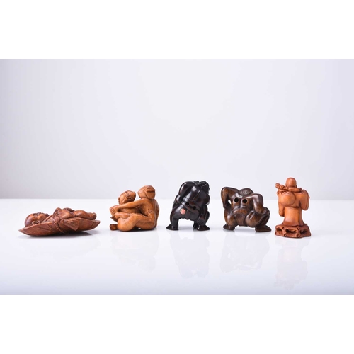 253 - A group of five Japanese wood netsuke, 20th century Including: a Sumo wrestler; Sumo wrestlers grapp... 