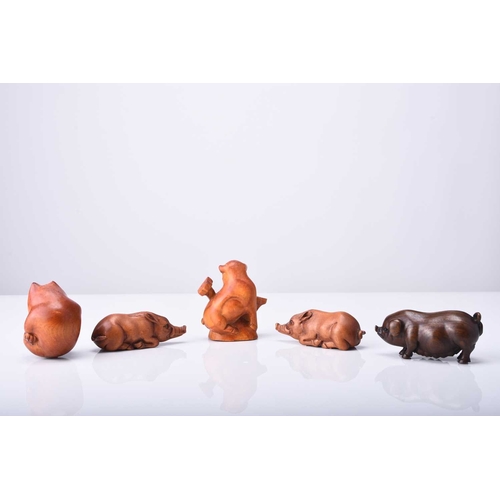 256 - A group of five Japanese wood netsuke of pigs and boars, 20th century Naturalistically and stylistic... 