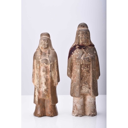 27 - Two Chinese buff pottery attendant figures, Tang Dynasty 18.5cm and 21cm high (repairs and restorati... 