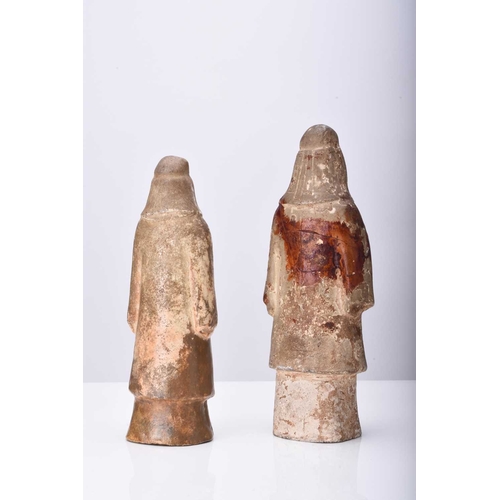 27 - Two Chinese buff pottery attendant figures, Tang Dynasty 18.5cm and 21cm high (repairs and restorati... 