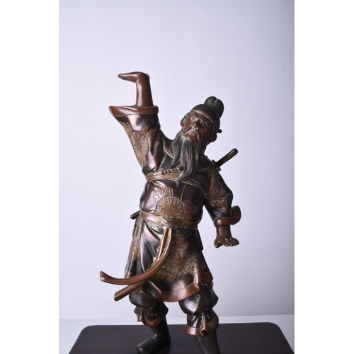 274 - A Japanese bronze figure of a warrior, Meiji era Modelled standing with one arm raised, he wears tra... 