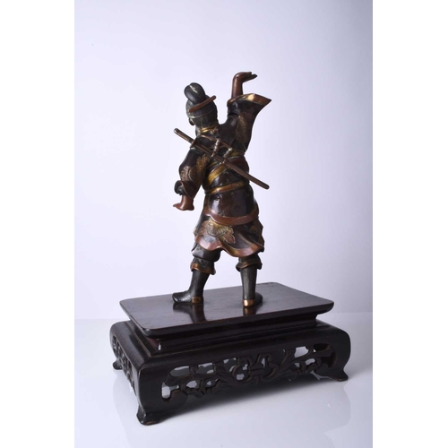 274 - A Japanese bronze figure of a warrior, Meiji era Modelled standing with one arm raised, he wears tra... 