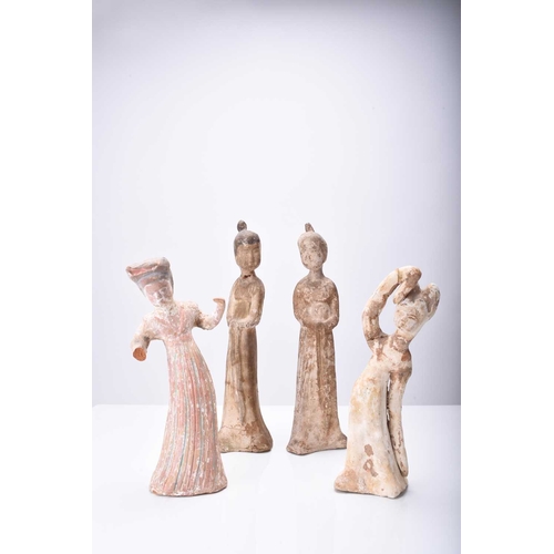 28 - Four Chinese pottery figures of maidens, Tang Dynasty Modelled wearing long robes and differing in p... 