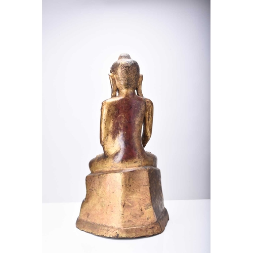 292 - A South East Asian gilt lacquer figure of a bodhisattva Early 20th century, modelled seated on a ped... 