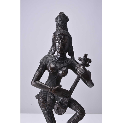 297 - A South Indian bronze figure of a goddess, 19th/20th century Probably Saraswati, modelled in dancing... 