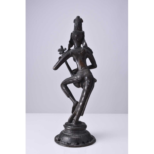 297 - A South Indian bronze figure of a goddess, 19th/20th century Probably Saraswati, modelled in dancing... 