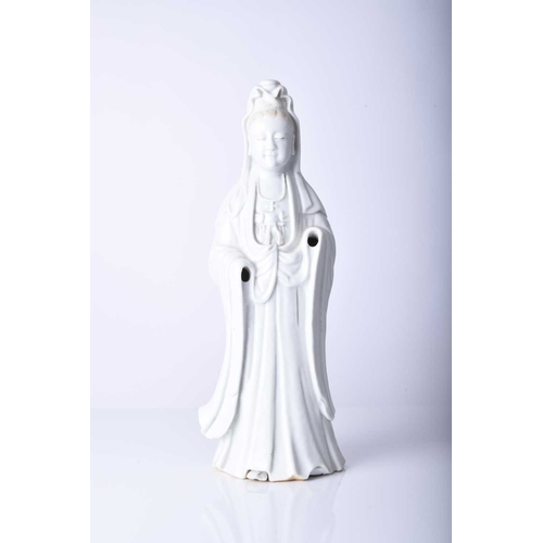 34 - A Chinese blanc de chine figure of Guanyin, Qing Dynasty Modelled standing. 33cm high (lacking hands... 