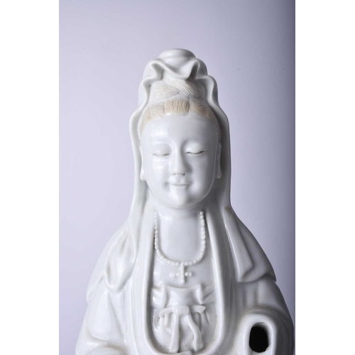 34 - A Chinese blanc de chine figure of Guanyin, Qing Dynasty Modelled standing. 33cm high (lacking hands... 