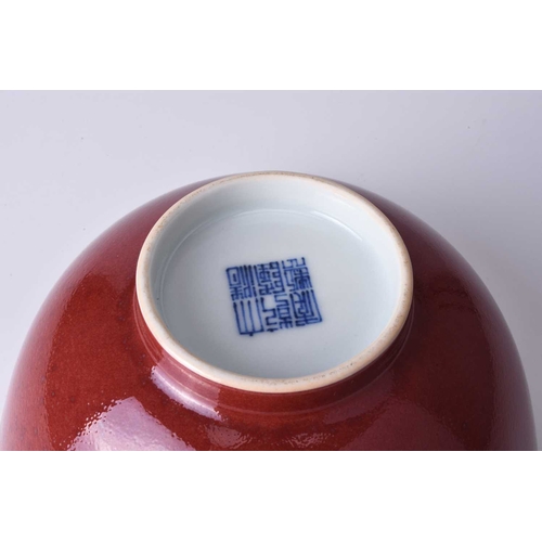 39 - A Chinese copper red bowl, Qianlong seal mark and of the period Of deep rounded form, the outside wi... 