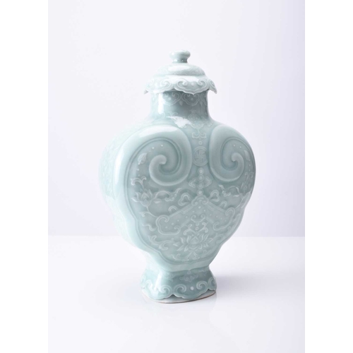 41 - A Chinese carved celadon-glazed Ruyi vase and cover Incised Qianlong seal mark but likely later Of l... 