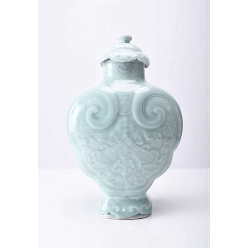 41 - A Chinese carved celadon-glazed Ruyi vase and cover Incised Qianlong seal mark but likely later Of l... 