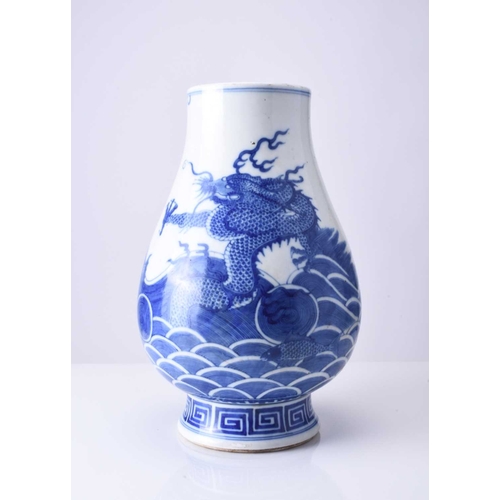 42 - A Chinese blue and white dragon vase Kangxi six-character mark but 19th century Of ovoid form with d... 