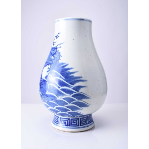 42 - A Chinese blue and white dragon vase Kangxi six-character mark but 19th century Of ovoid form with d... 